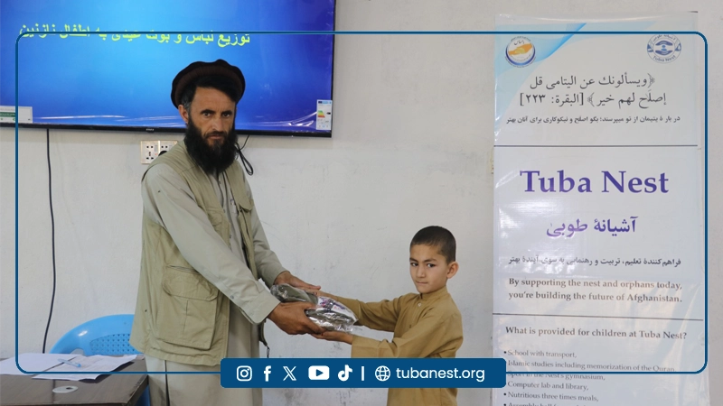 Orphan children receiving Eid clothes at Tuba Nest