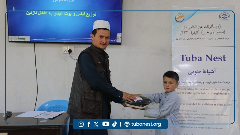 Orphan children receiving Eid clothes at Tuba Nest