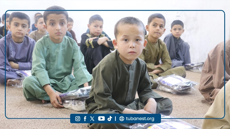 Orphan children receiving Eid clothes at Tuba Nest