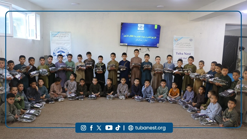Orphan children receiving Eid clothes at Tuba Nest
