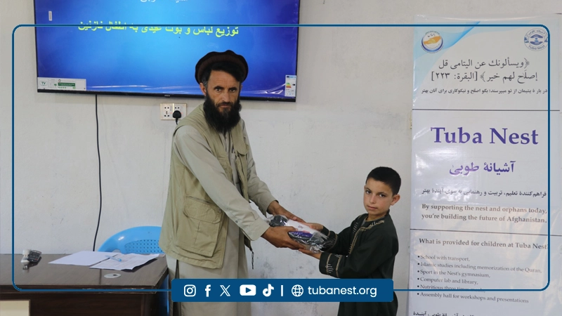Orphan children receiving Eid clothes at Tuba Nest